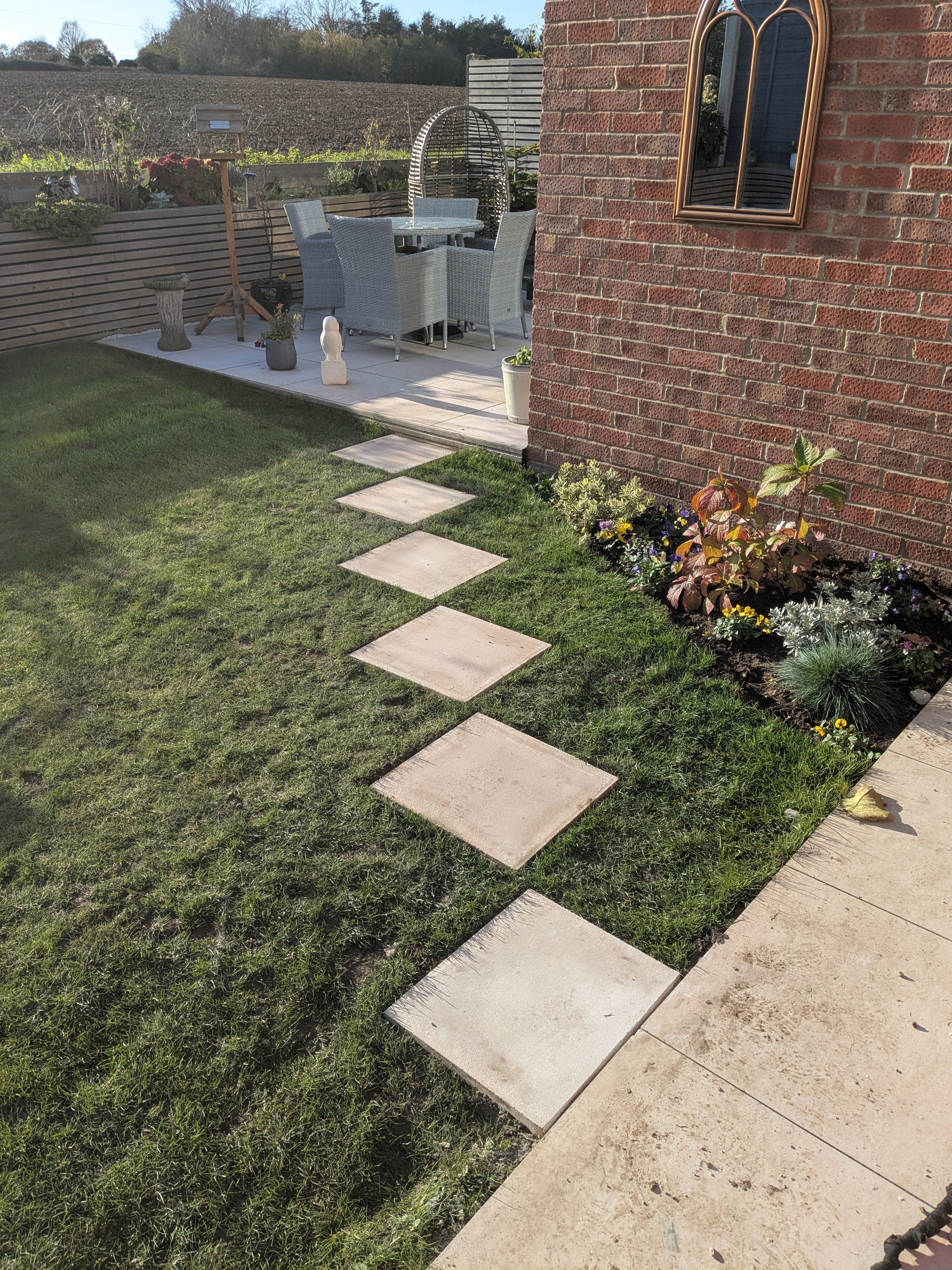 Garden patio with stepping stones and planting